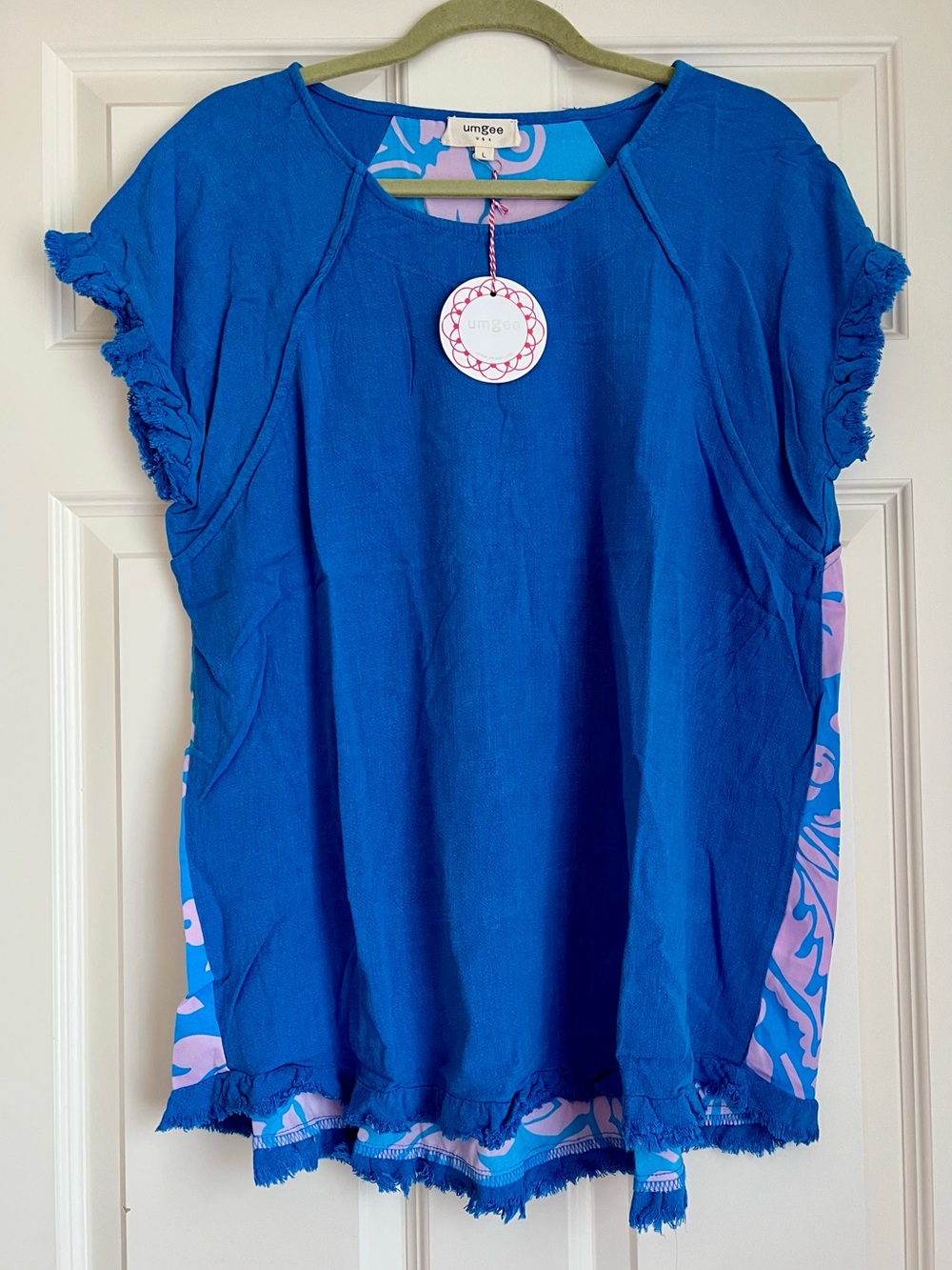 Umgee Blue Short Sleeve Top with Pink Accent in package